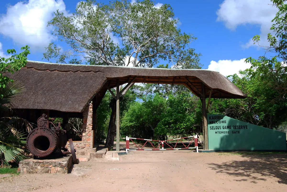 Thatched entrance gate to the reserve with an old cannon beside it